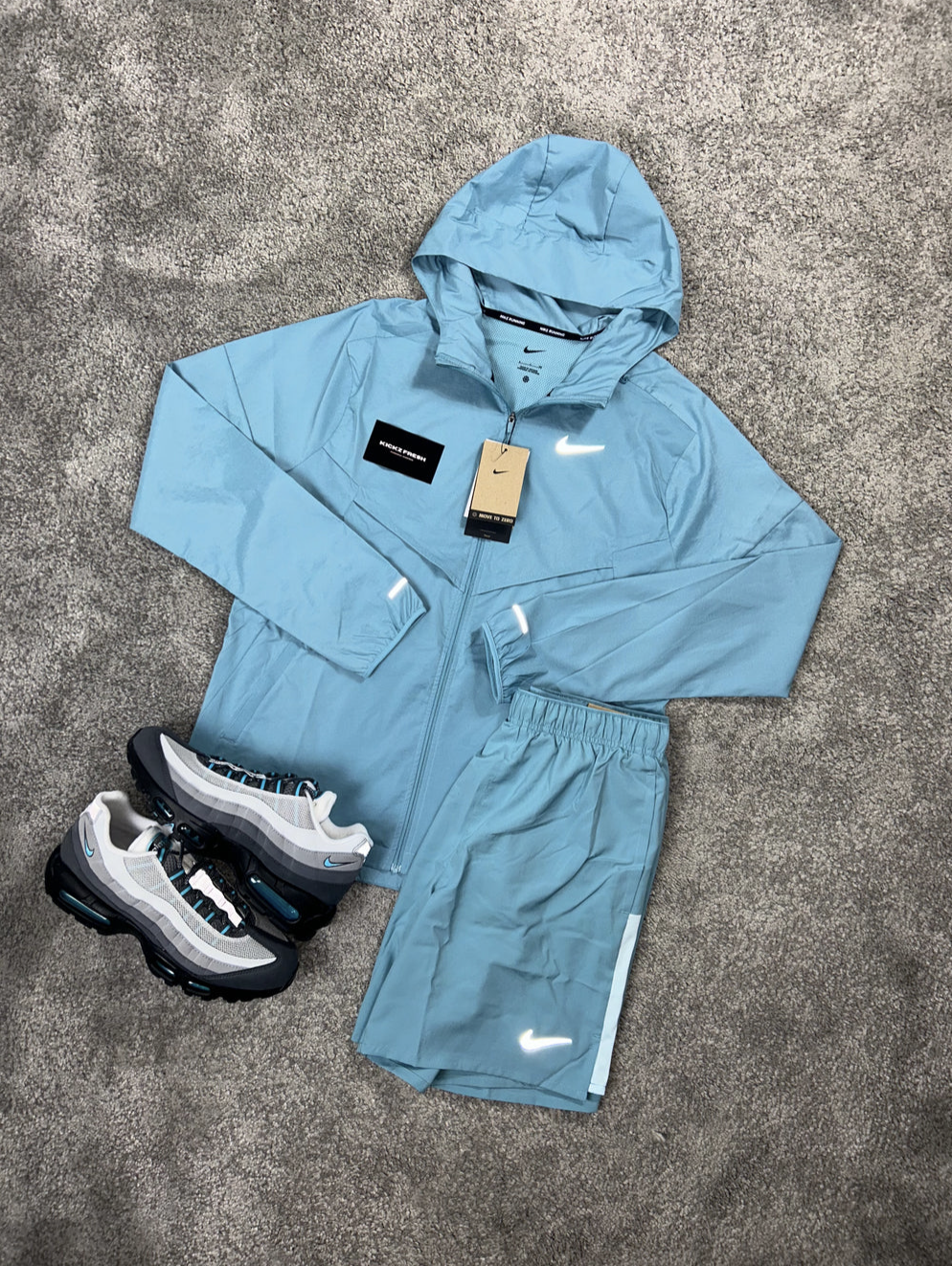 NIKE WINDRUNNER-SET IN ZEEBLAUW VOOR HEREN